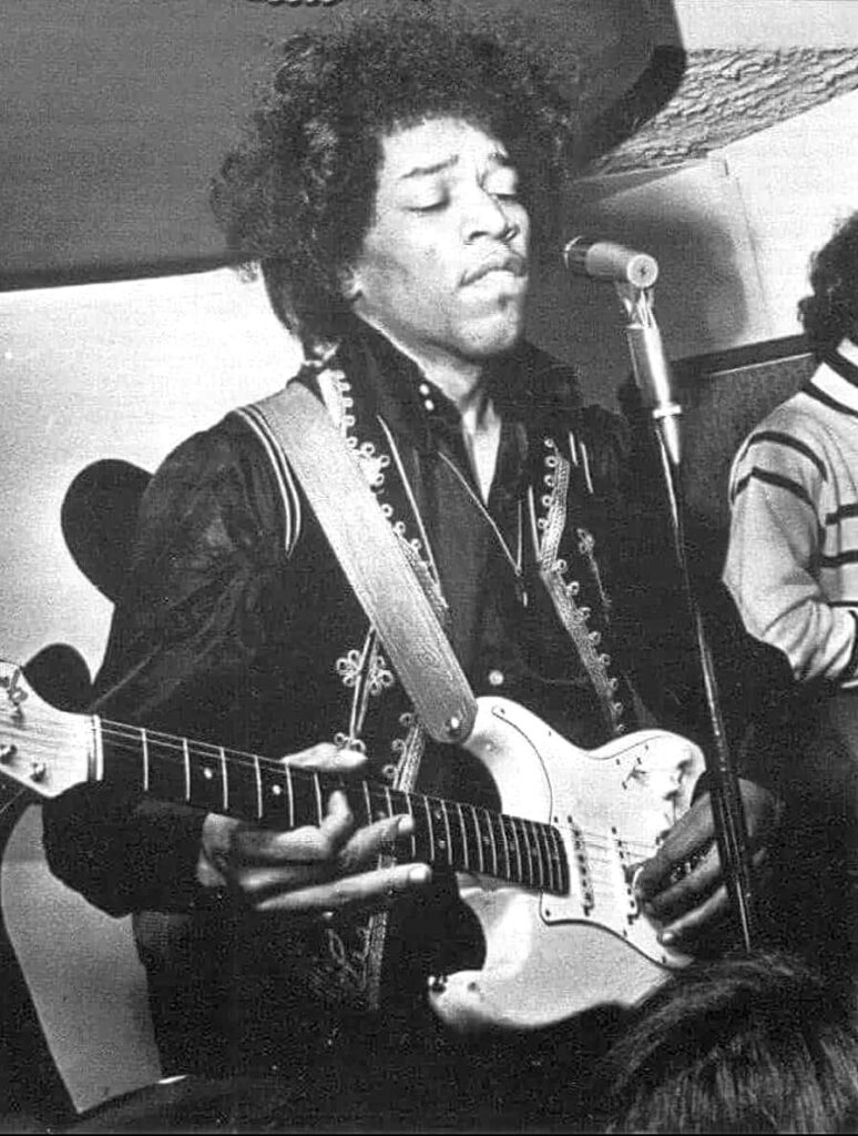 Jimi Hendrix playing his white 1964 Fender Stratocaster, nicknamed "Linda"