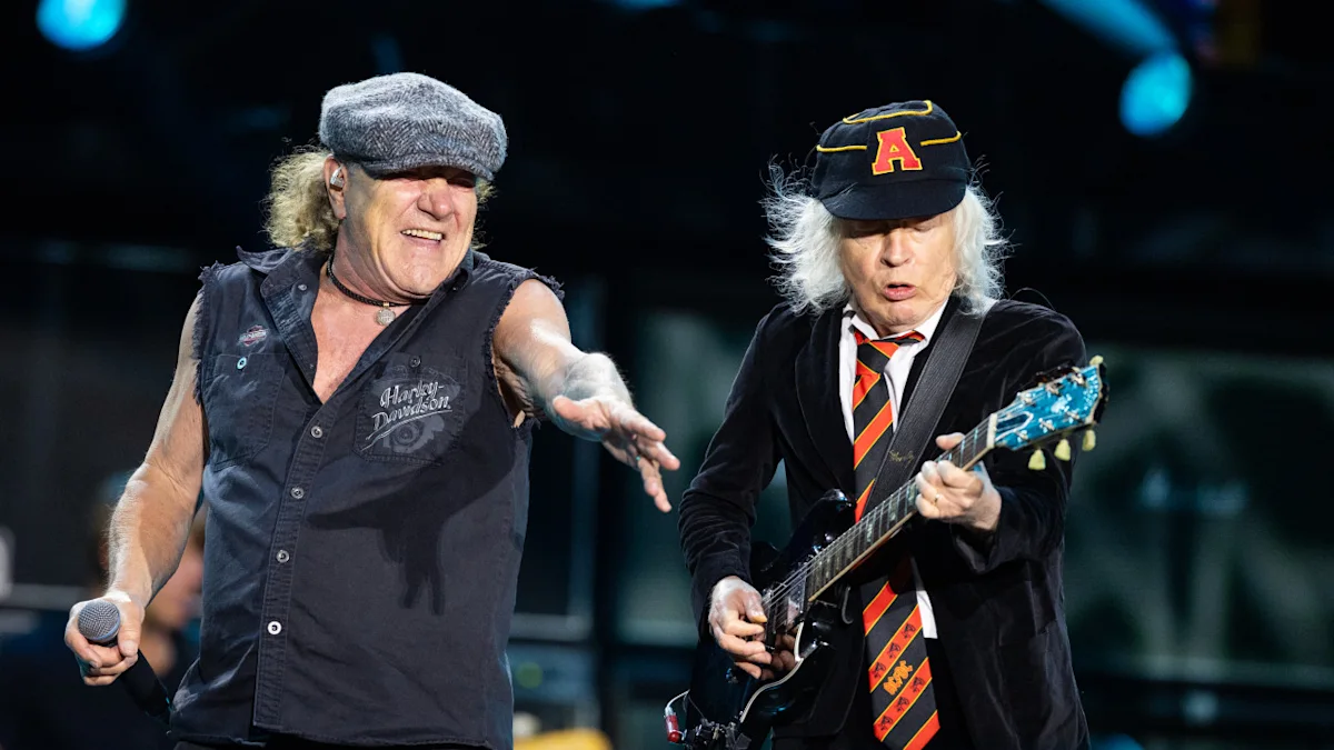 Singer Brian Johnson and Angus Young of AC/DC perform onstage during a concert at Merkur Spiel-Arena on July 08, 2025 in Duesseldorf, Germany. 
