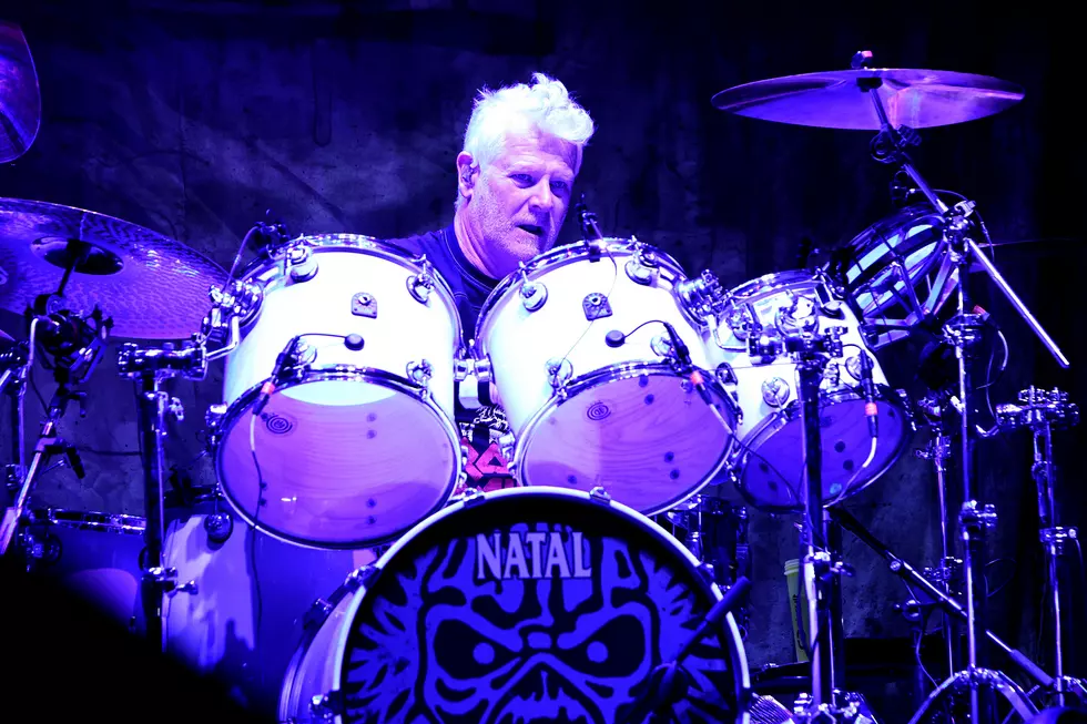 Simon Dawson performing live with Iron Maiden